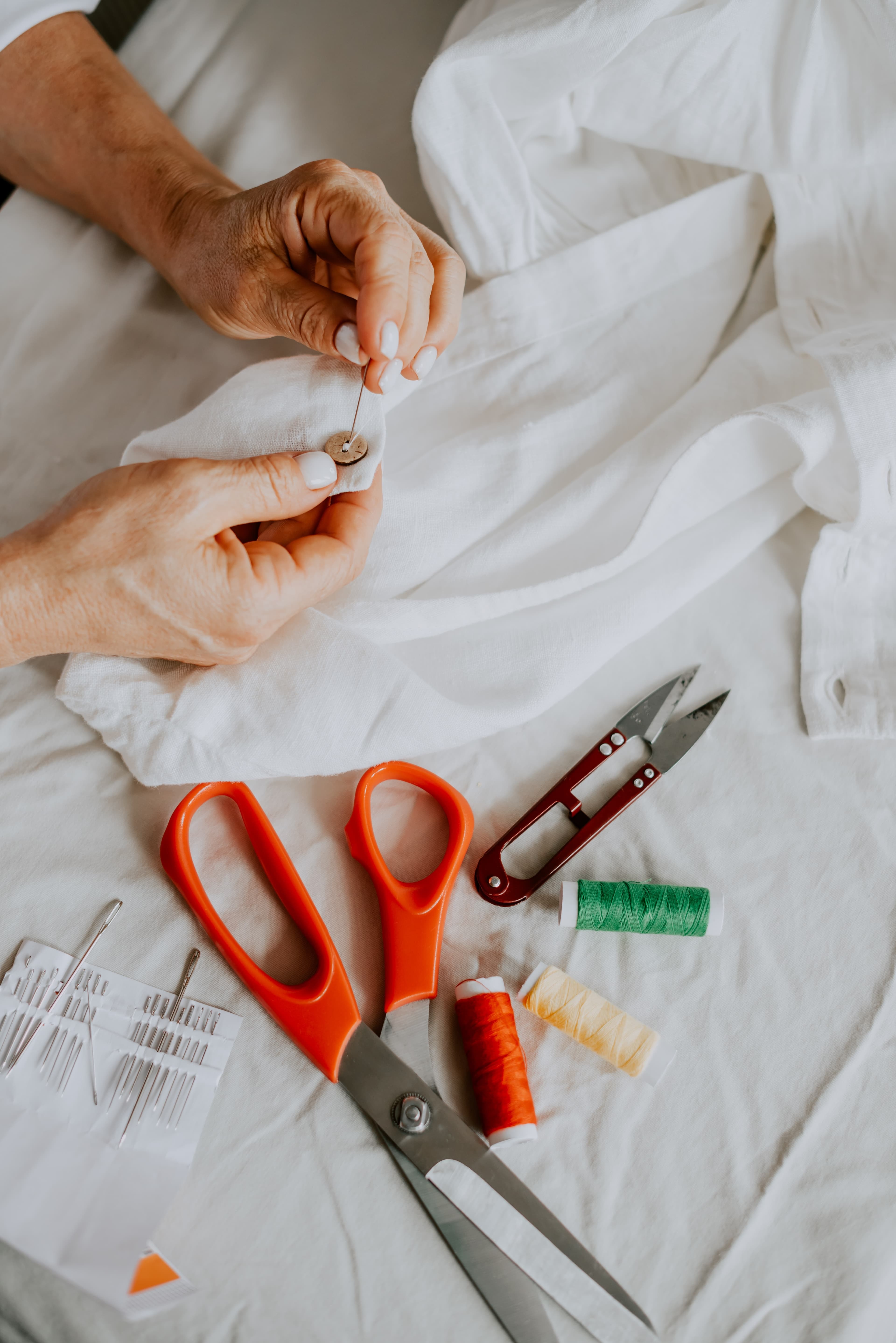 Woman mending a shirt