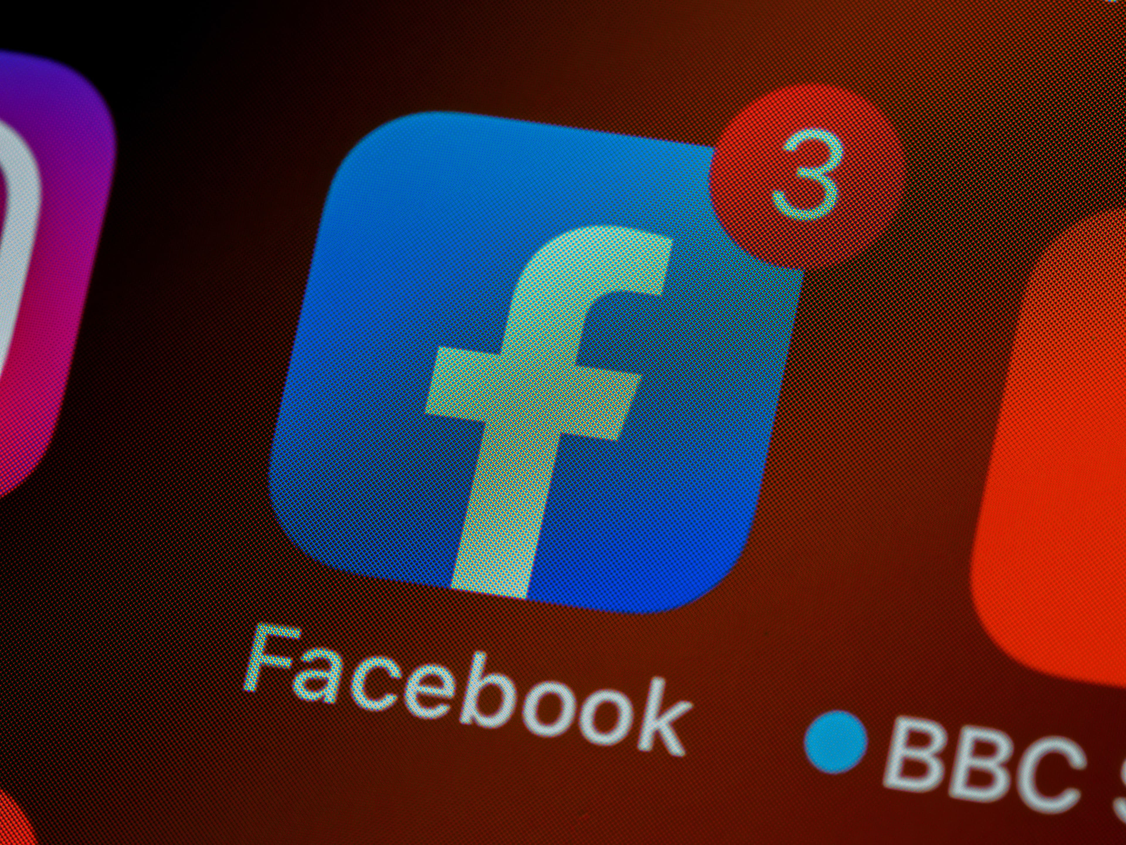 Facebook app icon on a cell phone