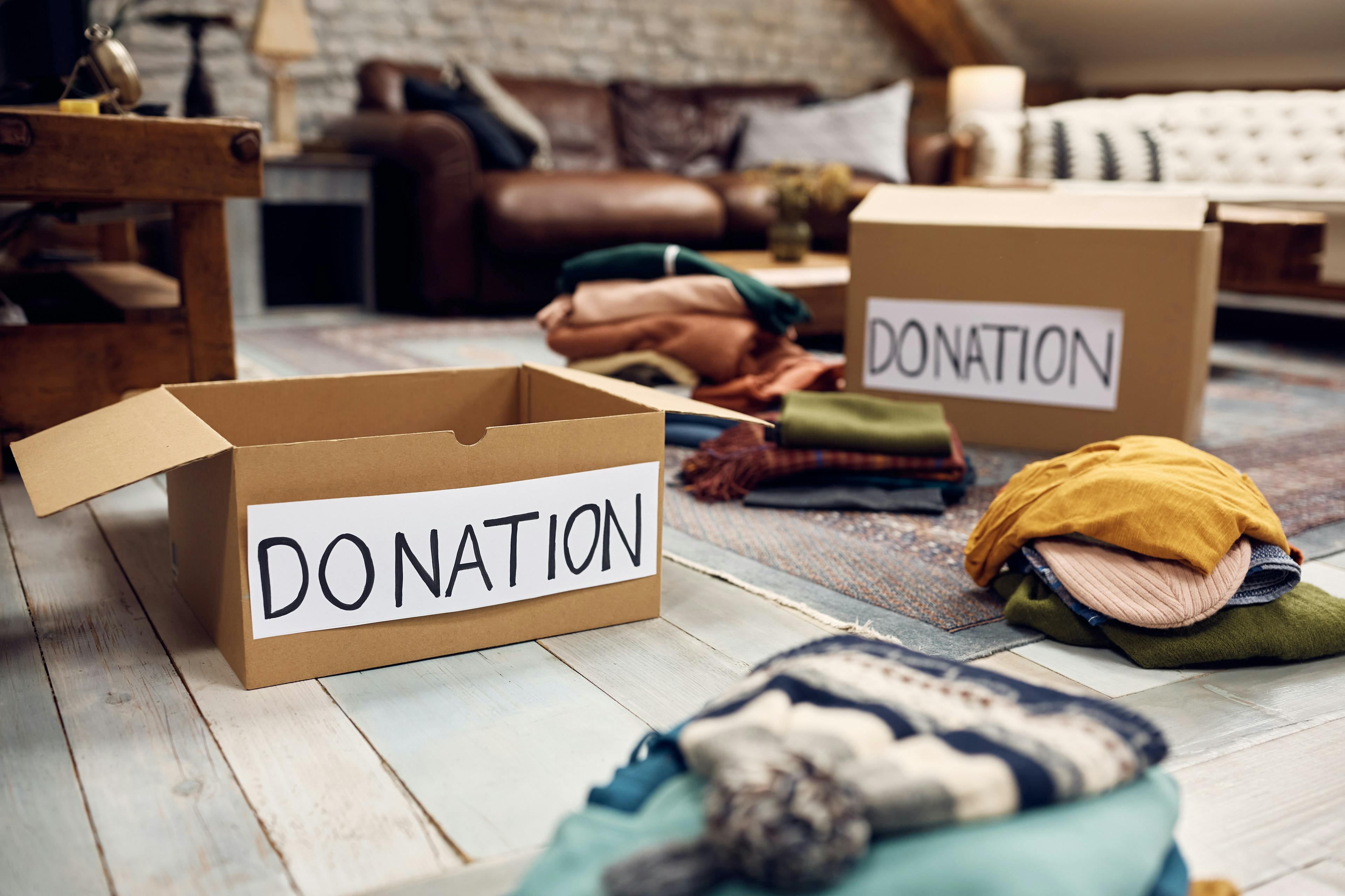 Cardboard boxes with the word donatation on them